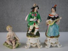 Three 20th century hand painted figures, a Staffordshire woman and man musician along with a