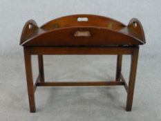 A 19th century style walnut butler's tray and stand, with four fold down sides, pierced handles