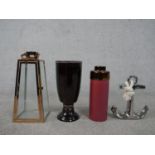 A Boconcept maroon and bronze glaze vase, a silver glaze anchor with rope, a copper and glass