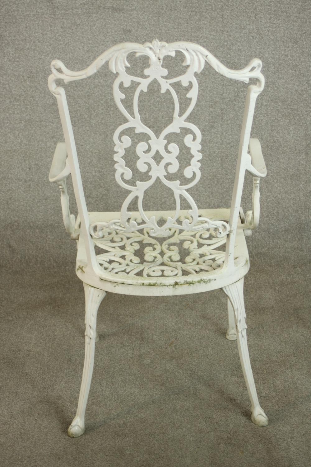 A set of six white painted cast iron carver garden chairs, with pierced splat back and open arms - Image 7 of 10