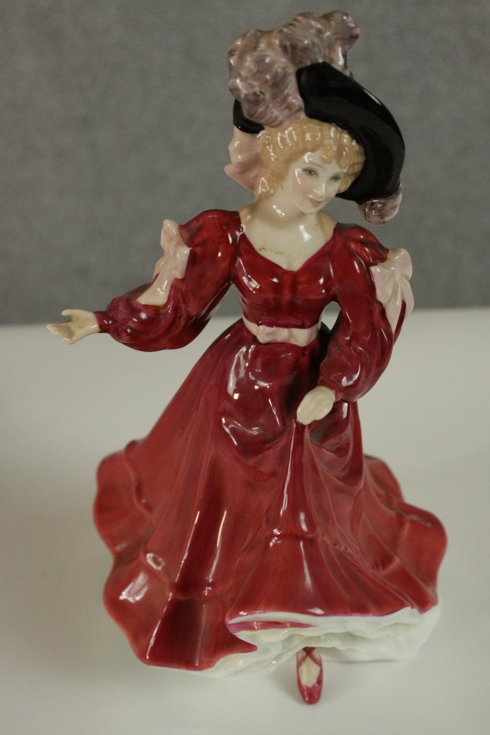 A collection of fifteen hand painted porcelain figures of ladies in a variety of coloured outfits by - Image 9 of 27