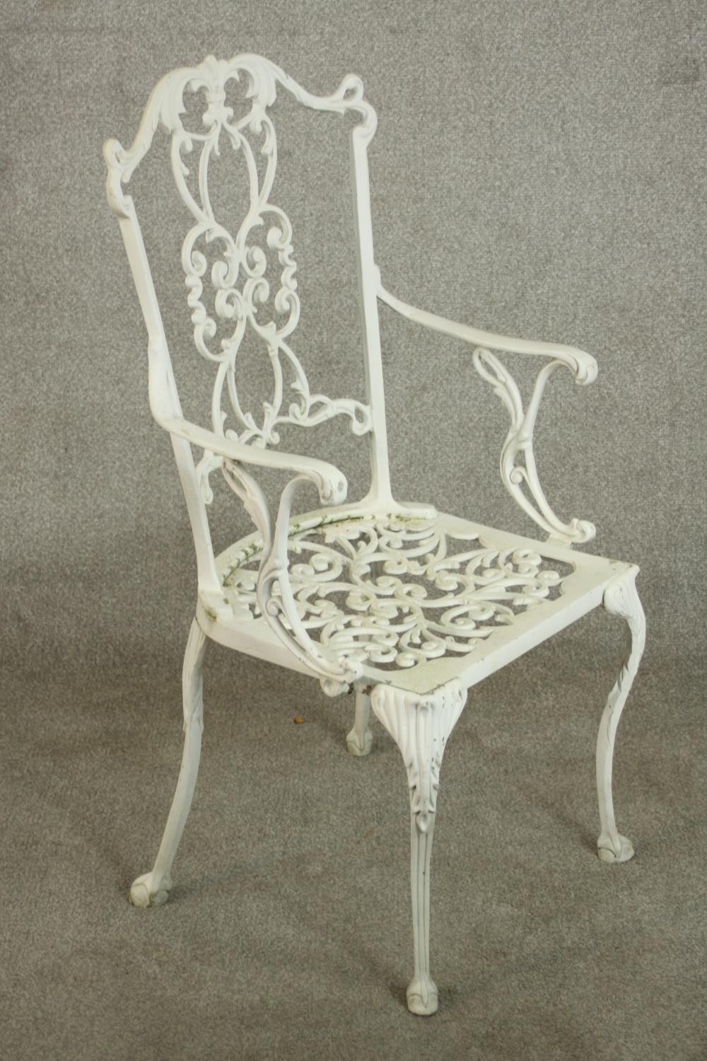 A set of six white painted cast iron carver garden chairs, with pierced splat back and open arms - Image 5 of 10