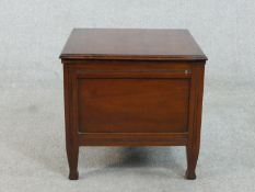 A late Victorian walnut commode, of square form, the lid revealing fitted ceramic interior. H.42 W.
