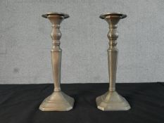 A pair of Danish Broste pewter candlesticks. Label to the base. H.28 W.10 D.10cm
