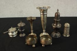 A collection of 19th and 20th century silver items, including two weighted silver trumpet vases, a