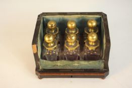 A 19th century six bottle perfume box, inlaid with burr wood panels, missing the front and lid, with