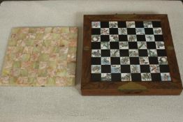 A Chinese folding figural chess set along with an alabaster and marble chess board. H.10 W.36 D.