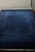 A blue ground hand woven Tibetan carpet. L.300 W.220cm.