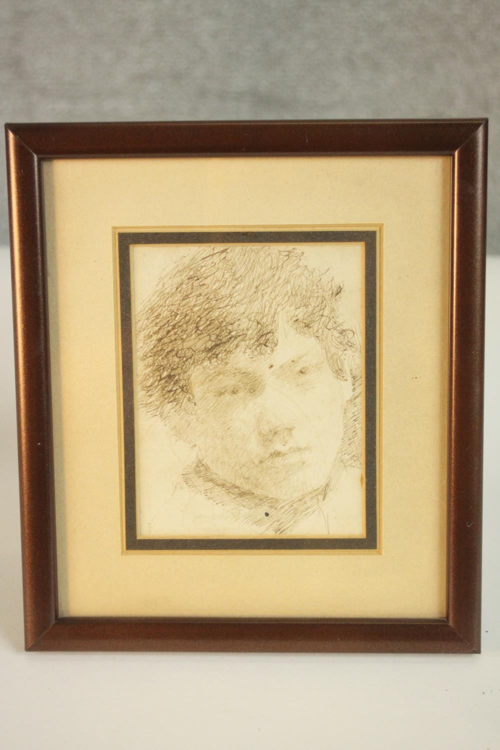 A framed and glazed pen drawing of a young boy, unsigned. H.20 W.17cm. - Image 2 of 5