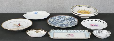 A collection of ceramics and porcelain, including a Majolica sun design plate, a Noritake plate