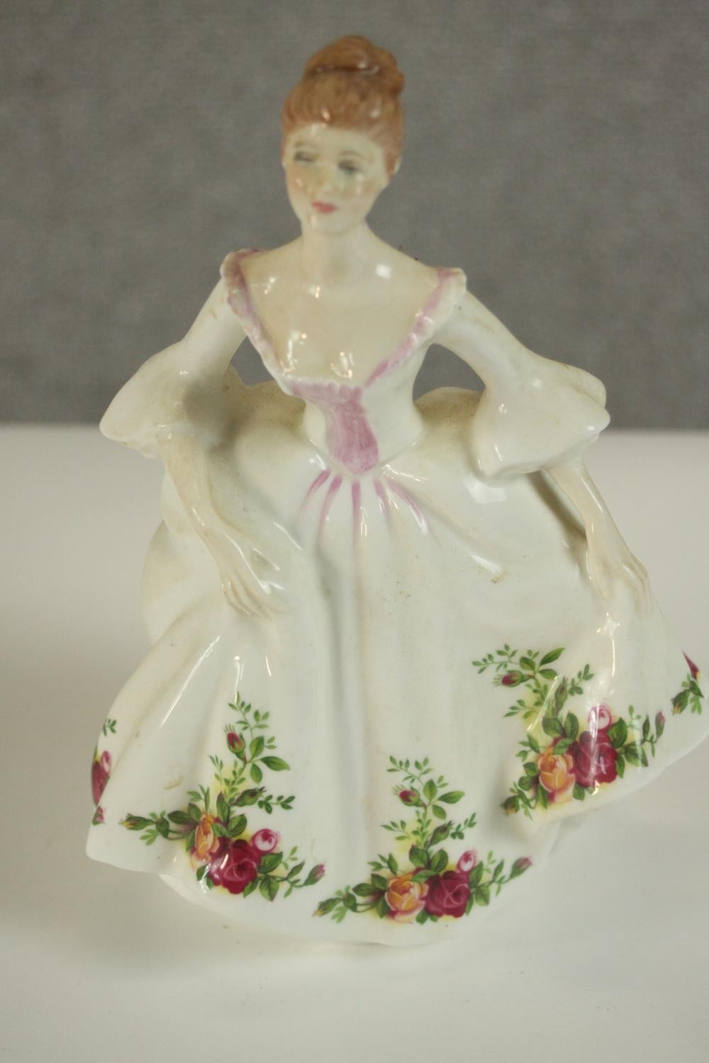 A collection of fifteen hand painted porcelain figures of ladies in a variety of coloured outfits by - Image 11 of 27