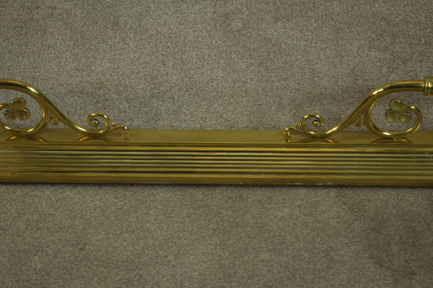 A late 19th/early 20th century brass fender, with wrythen urn supports, the rails terminating in - Image 4 of 6