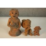 Three 20th century sculpted Mexican terracotta figures. H.22 W.10 D.10cm. (largest)