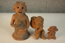 Three 20th century sculpted Mexican terracotta figures. H.22 W.10 D.10cm. (largest)
