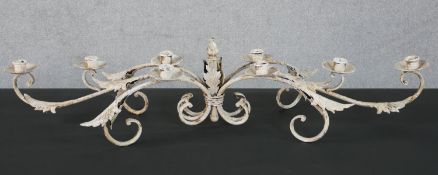 A French wrought iron and painted centrepiece candelabrum, with six scrolling leaf mounted