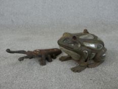 A vintage blown glass and cast iron frog tea light holder along with a long horn beetle boot