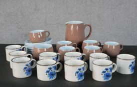 A set of ten Midwinter Stonehenge shape tea cups painted with blue flowers, together with a