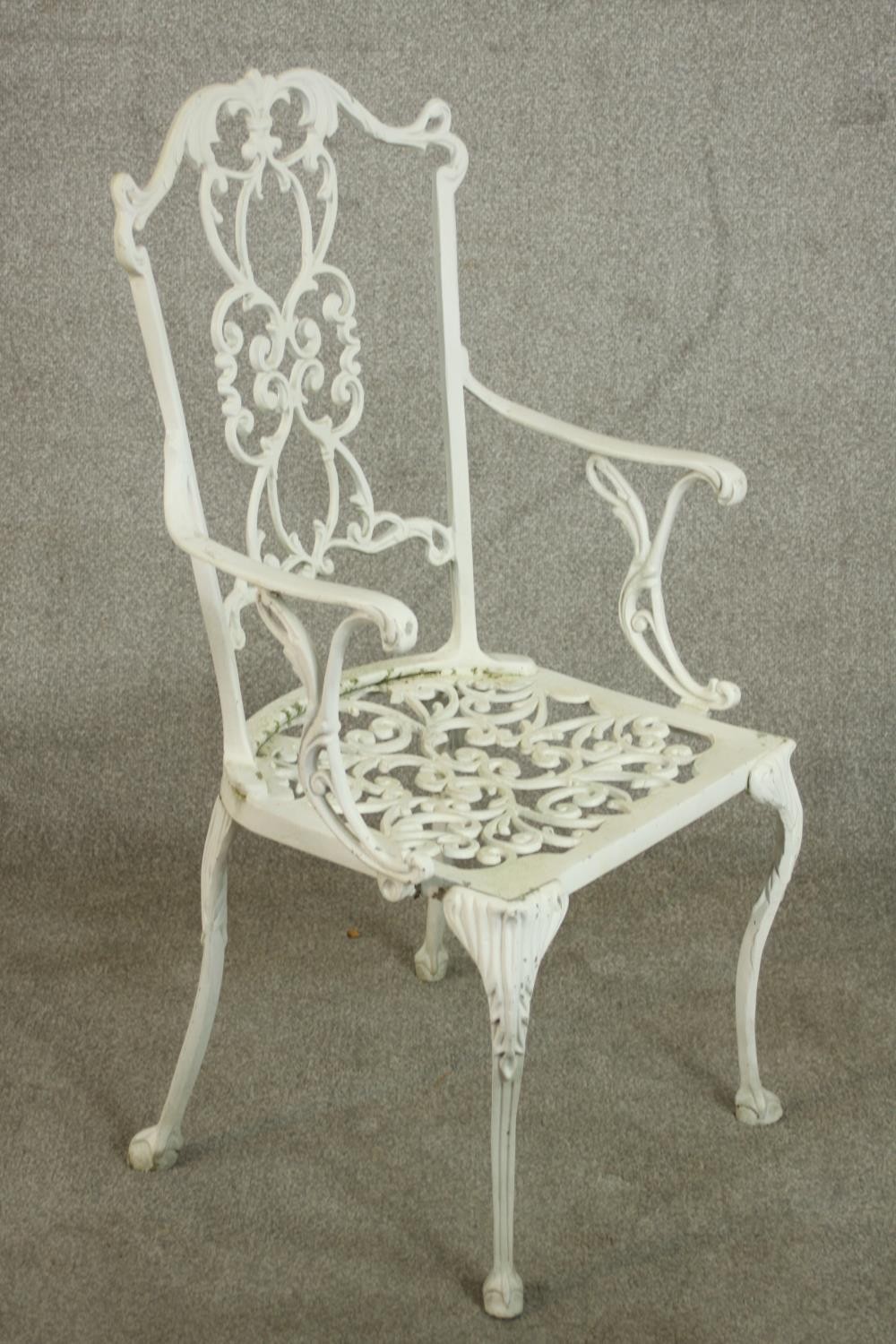 A set of six white painted cast iron carver garden chairs, with pierced splat back and open arms - Image 4 of 10