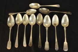 A collection of eleven silver serving spoons, including a pair of Georgian serving spoons (HB for