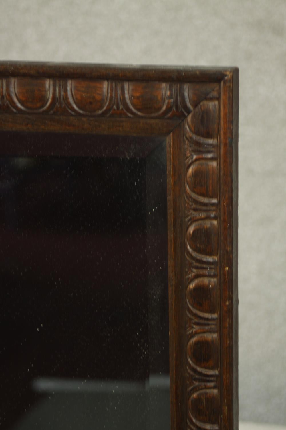 An early 20th century rectangular oak wall mirror, the frame carved with an egg and dart type - Image 3 of 5