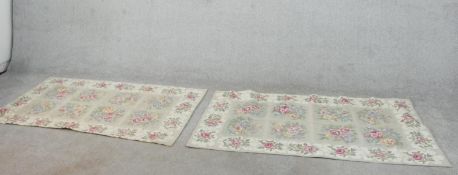 A pair of grey ground hand made Chinese needlepoint rugs with floral design. L.151 W.89cm