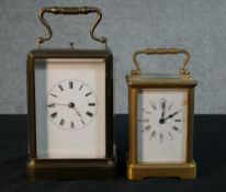 Two early 20th century gilt brass carriage clocks. The larger one with white enamel dial with