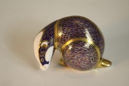 A Royal Crown Derby porcelain paperweight in the form of a badger, in the Imari palette with