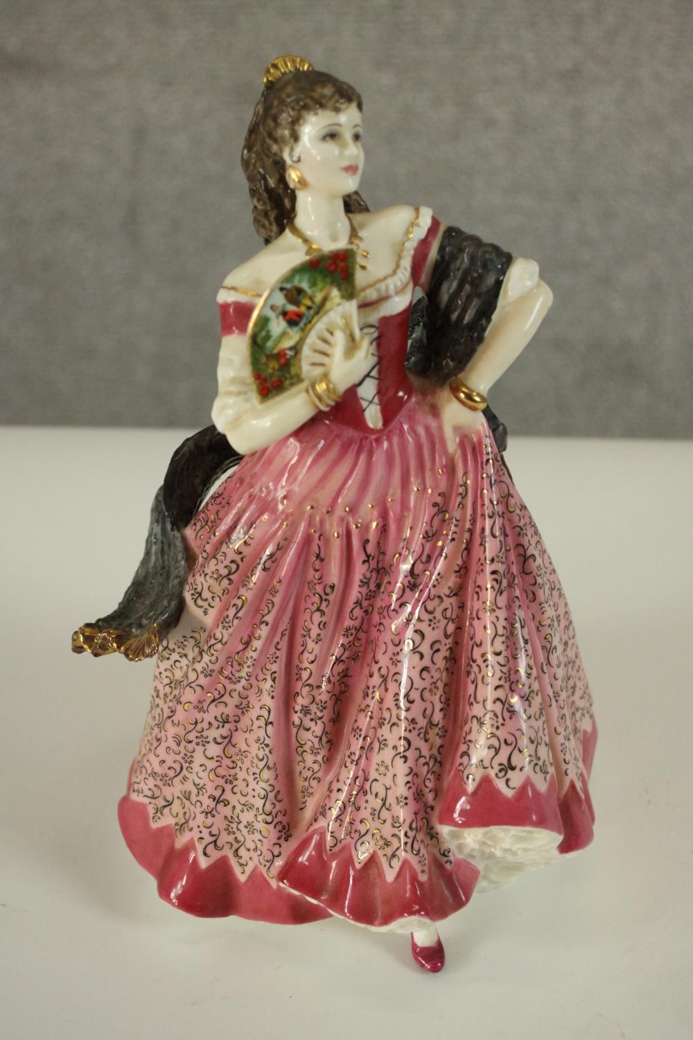 A collection of fifteen hand painted porcelain figures of ladies in a variety of coloured outfits by - Image 27 of 27