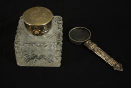 A silver timepiece lidded glass inkwell by John Grinsell & Sons, the hinged lid revealing a crown