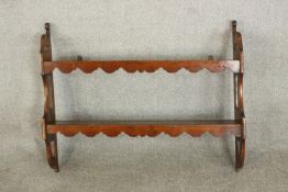 A set of 19th century pine wall shelves, the two shelves with undulating fronts, the sides with