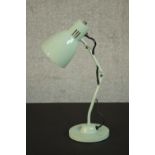 A pale green enamel retro mstyled anglepoise style desk lamp on a circular base. H.44 Dia.14cm.