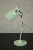 A pale green enamel retro mstyled anglepoise style desk lamp on a circular base. H.44 Dia.14cm.