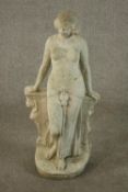 A reconstituted stone garden figure of an Ancient Egyptian lady leaning against a wall. H.76 W.35