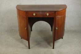 An unusual 19th century walnut bow fronted kneehole sideboard, with a single drawer flanked by