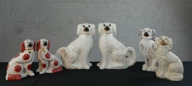 Two pairs of 19th century Staffordshire pottery spaniels, one with liver spots along with two