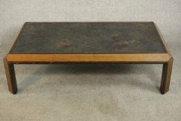 An unusual G-Plan teak coffee table of square form with a weathered effect top, label to the