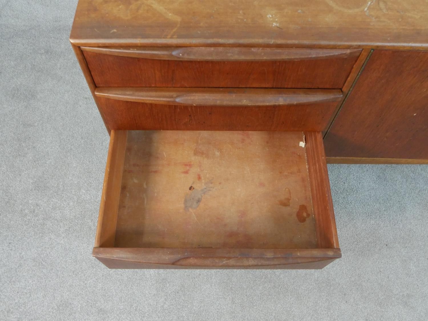 An A. H. McIntosh Ltd circa 1950s teak sideboard, with a pair of cupboard doors, flanked on one side - Image 9 of 11