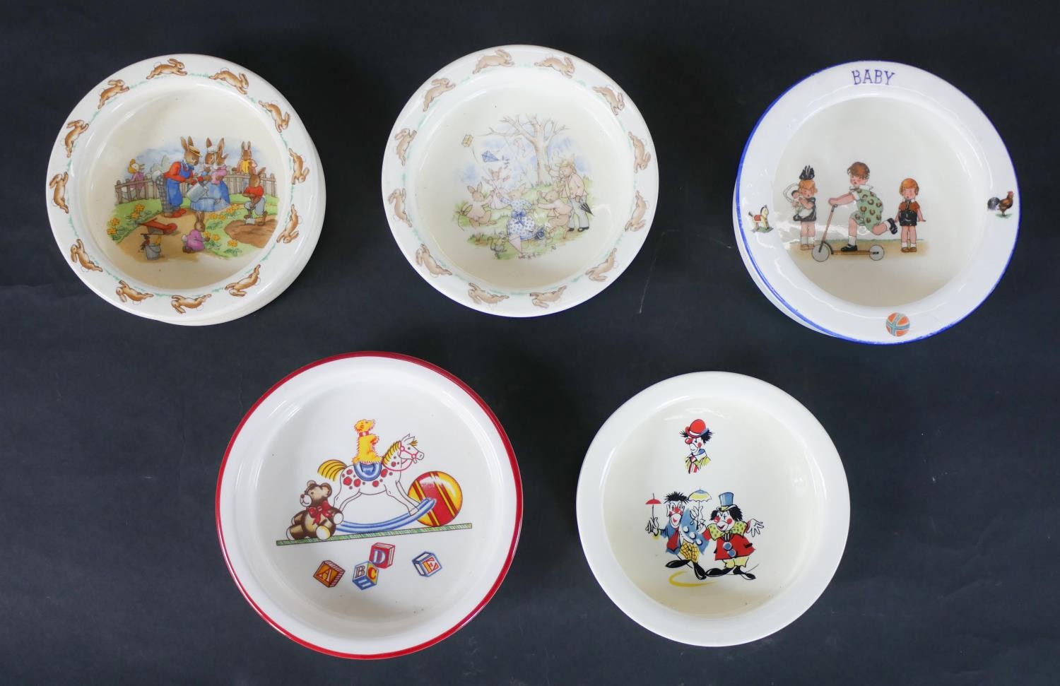 A collection of five children’s nursery ware bowls, including two Royal Doulton Bunnykins bowls.