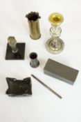 A collection of metal and glass items, including two brass trench art pen pots, a blown silver