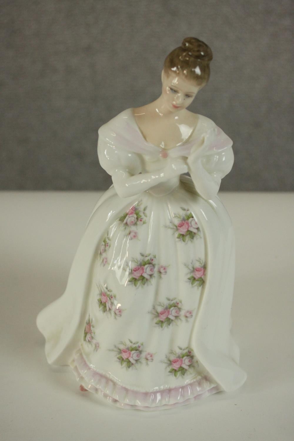 A collection of fifteen hand painted porcelain figures of ladies in a variety of coloured outfits by - Image 23 of 27