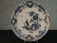 An 18th century English Delft tin glazed earthenware plate, possibly Bristol, blue and white painted