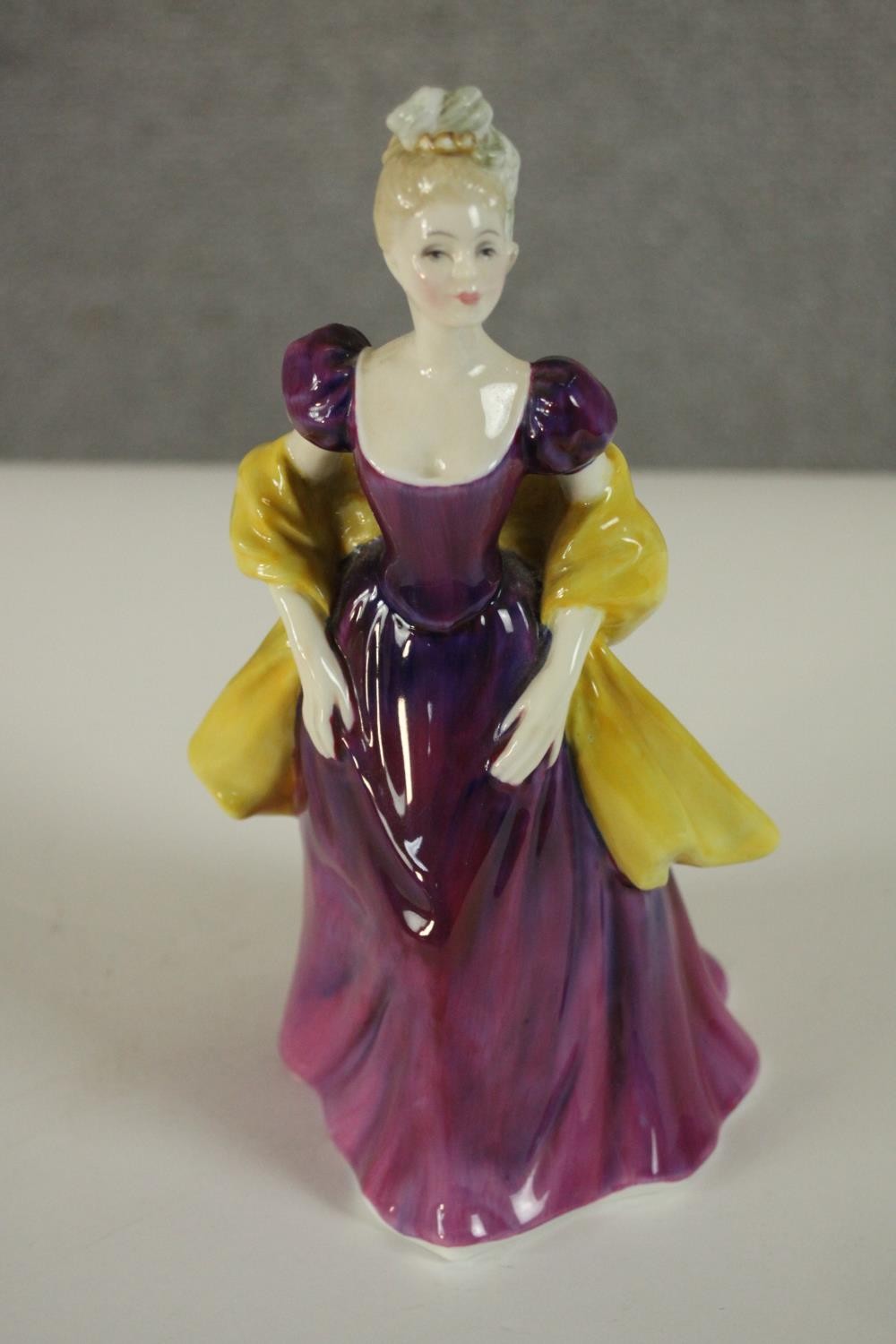 A collection of fifteen hand painted porcelain figures of ladies in a variety of coloured outfits by - Image 21 of 27