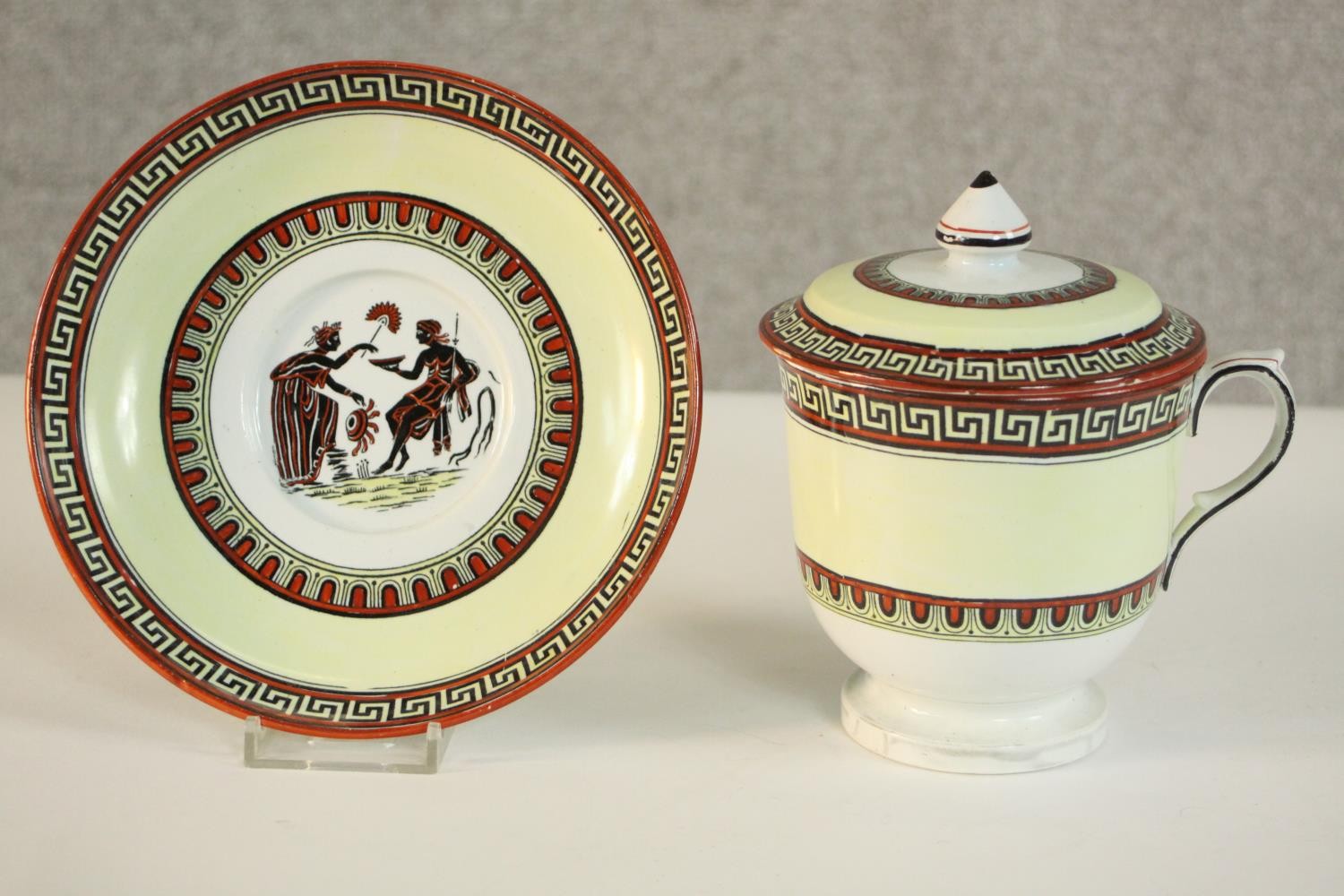 A Classical Greek key and figural design lidded hot chocolate cup and saucer, makers mark and
