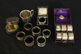 A collection of silver and silver plate, including a cased set of six engraved foliate design napkin