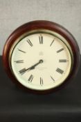 A Victorian style mahogany framed quartz wall clock with black Roman numerals. Dia.33 Depth.10cm.