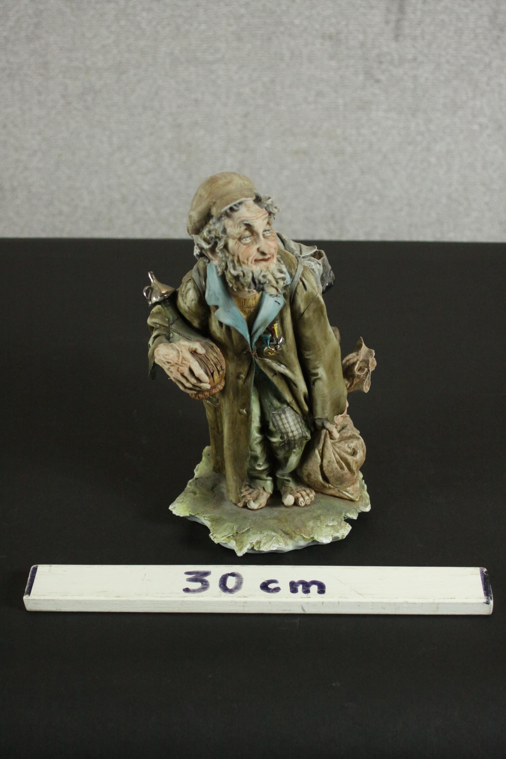 An Italian Capo di Monte barefoot tramp figure on a naturalistic base. H.27 W.15 D.14cm. - Image 2 of 9