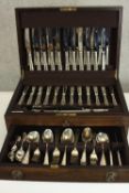 A complete Harrods Ltd mahogany canteen of silver plate cutlery for twelve people. All stamped '