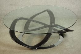A contemporary Italian Porada infinity glass topped coffee table, with a circular plate glass top.