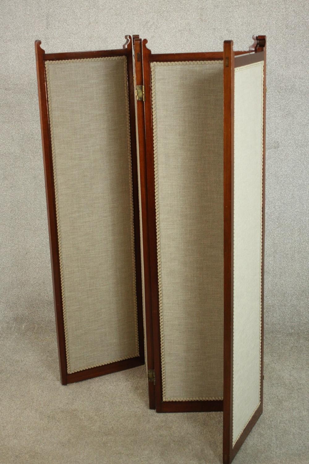 An Edwardian walnut fourfold screen, each panel upholstered with an oatmeal coloured fabric, with - Image 7 of 10