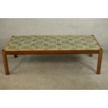 A circa 1970s simulated rosewood coffee table, the rectangular top set with twenty one tiles in hues